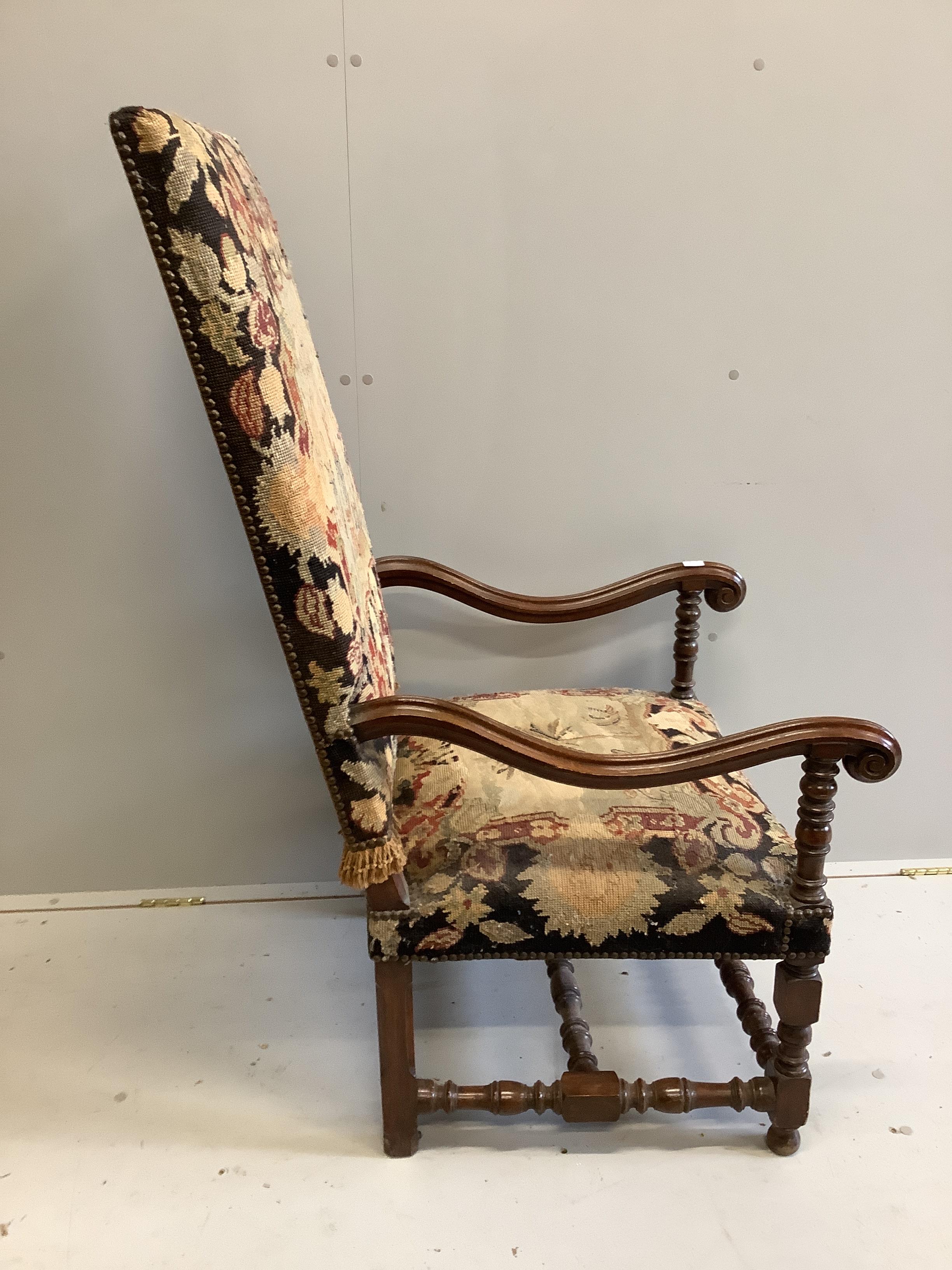 An upholstered 18th century style French walnut elbow chair, width 62cm, depth 78cm, height 122cm